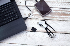 A laptop computer with several external storage devices